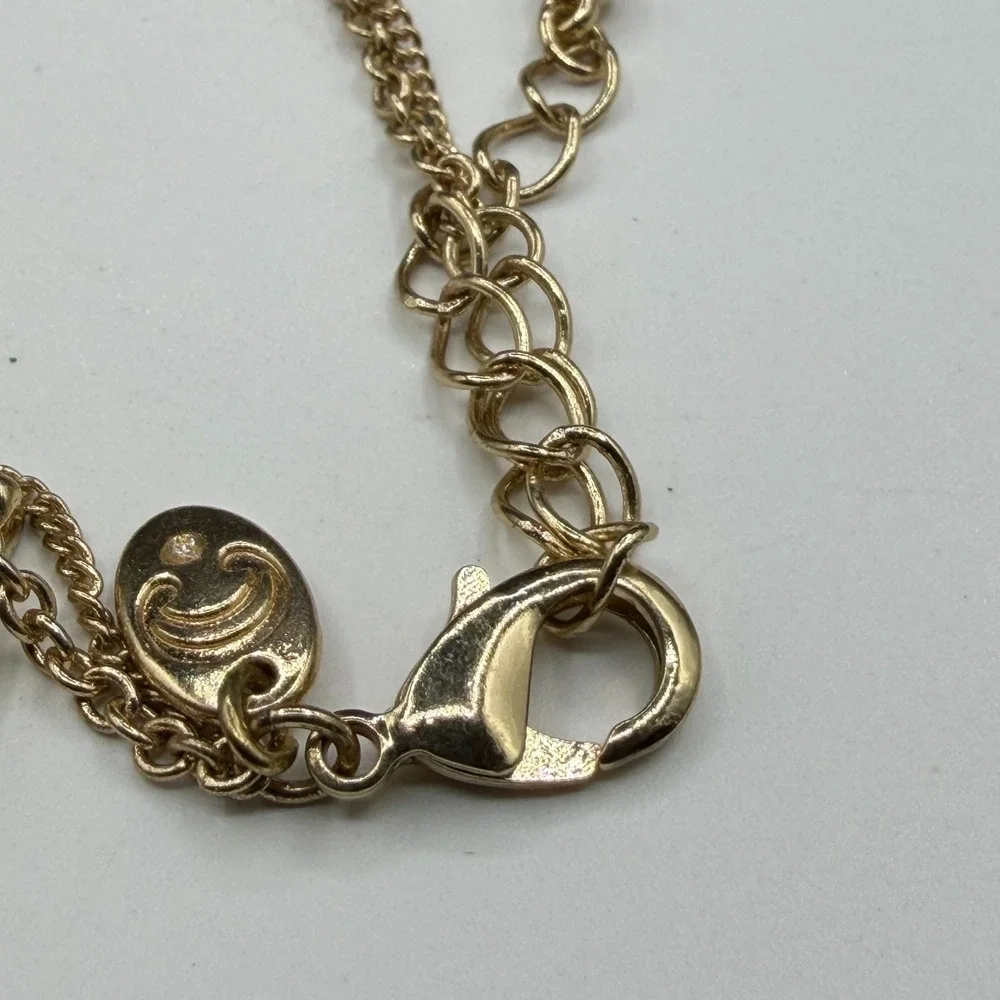 Charming Charlie ornate gold